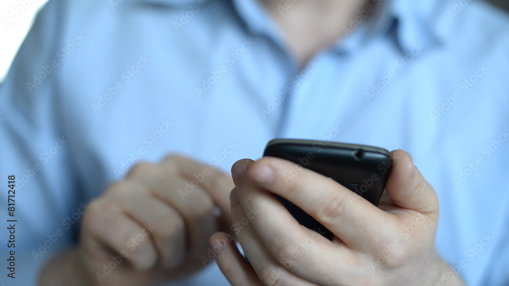 Man using mobile phone.