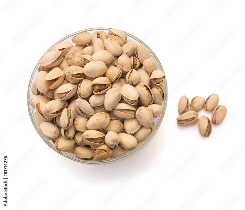 Pistachio nuts in a glass bowl with clipping path Pistachio nuts in a glass bowl with clipping path