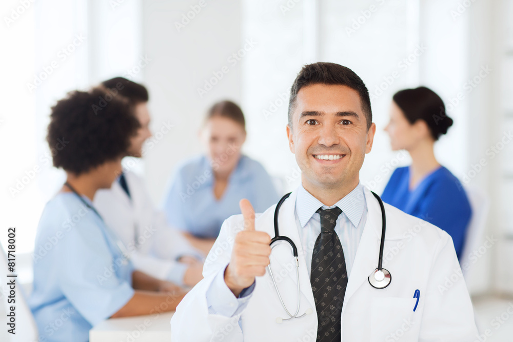 happy doctor over group of medics at hospital happy doctor over group of medics at hospital