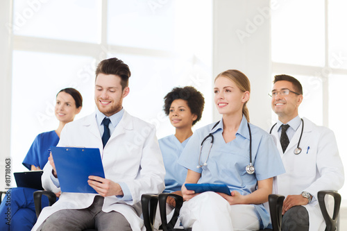 group of happy doctors on seminar at hospital