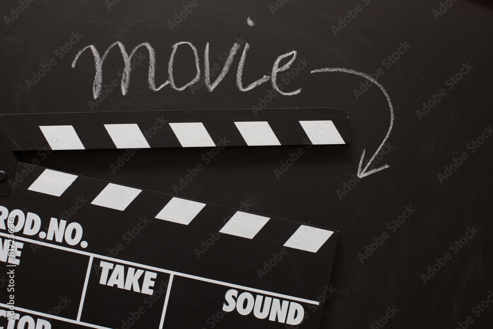 Film clapboard movie on blackboard background