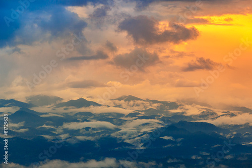 Sunset scene with fog and mountain