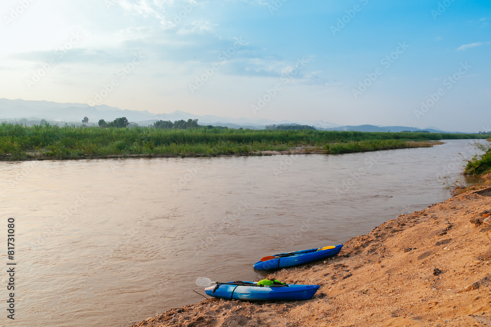 Two canoe on the sand near the river , Mae Hong Son Two canoe on the sand near the river , Mae Hong Son