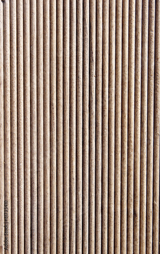 Wooden brown grooves panel closeup