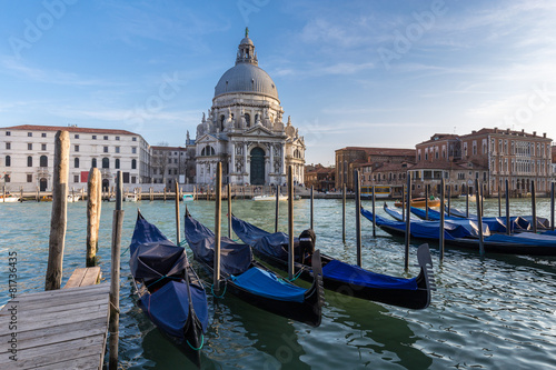 Gondolas in Grand Canal and Basilica Santa Maria della Salute in