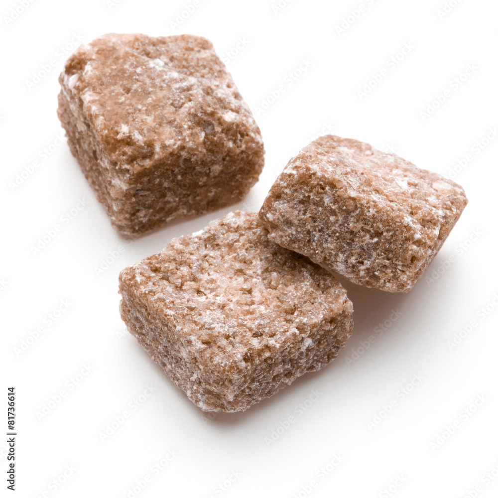 Brown lump cane sugar cube isolated on white background cutout Brown lump cane sugar cube isolated on white background cutout
