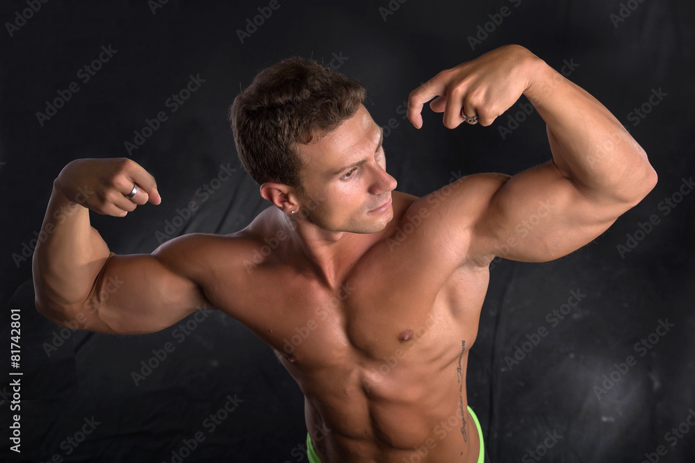 Handsome shirtless bodybuilder shot from above, standing Handsome shirtless bodybuilder shot from above, standing