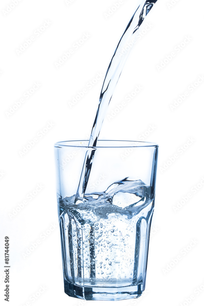 Pouring water into glass on white background Pouring water into glass on white background