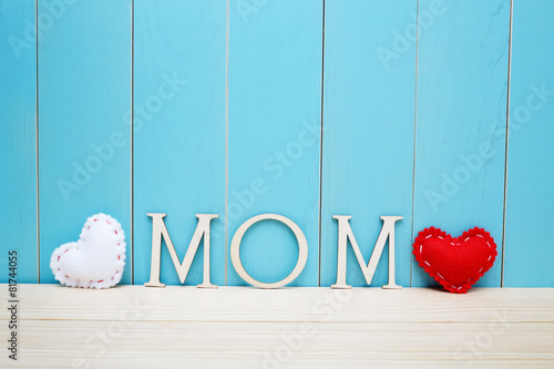 MOM text letters with white and red hearts