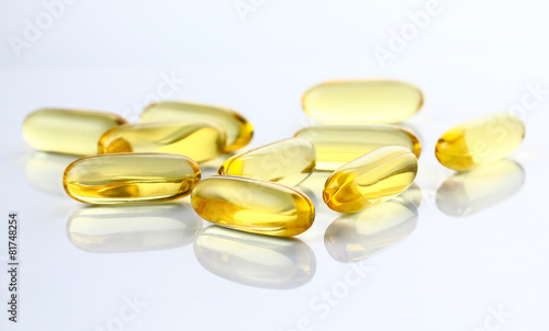 Capsules of fish oil, Omega 3 on gray background