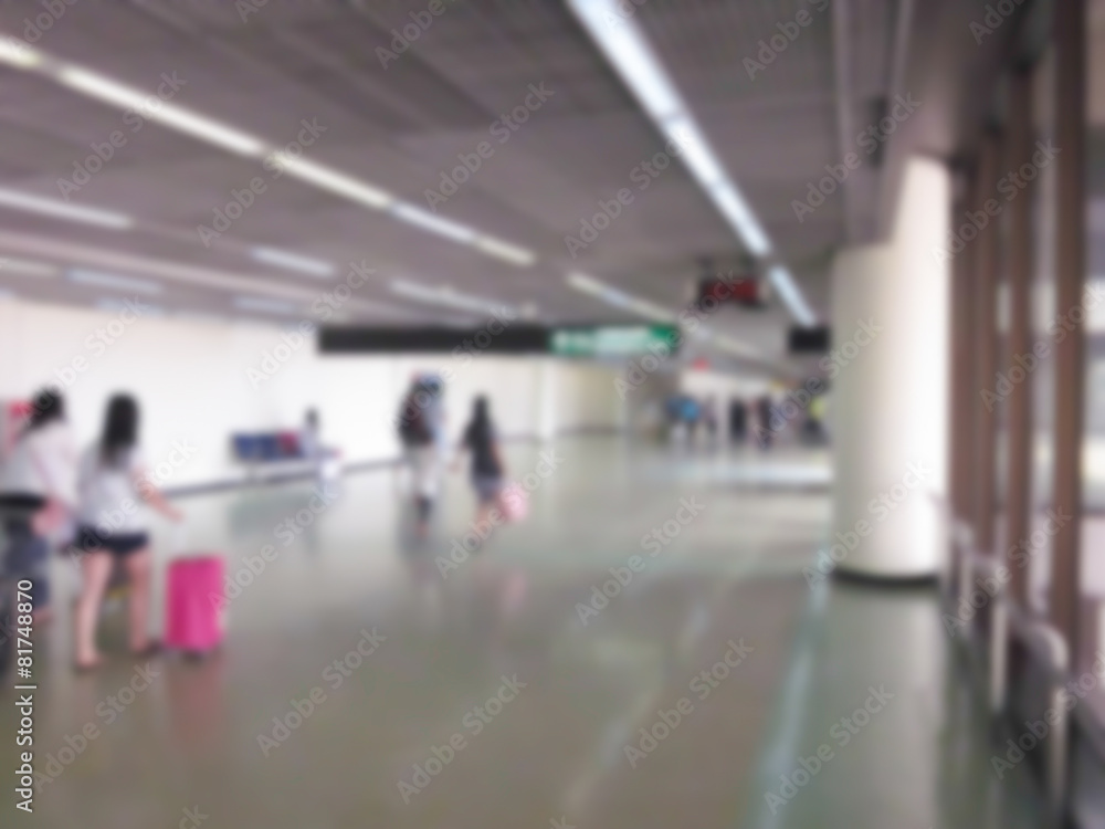 blurry defocused people in airport