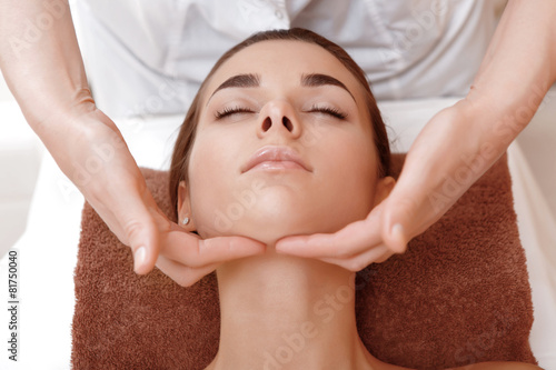 Beautician makes face massage