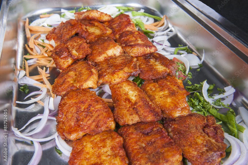 Grilled tawa fish at an indian restaurant buffet