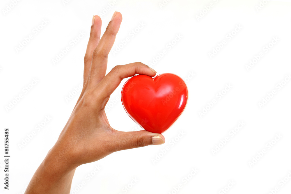 Hand holding red heart shape Hand holding red heart shape