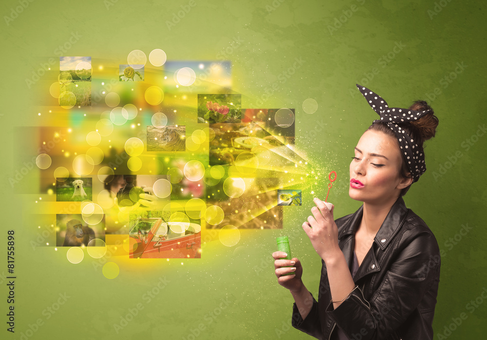 Obraz premium Cute girl blowing colourful glowing memory picture concept