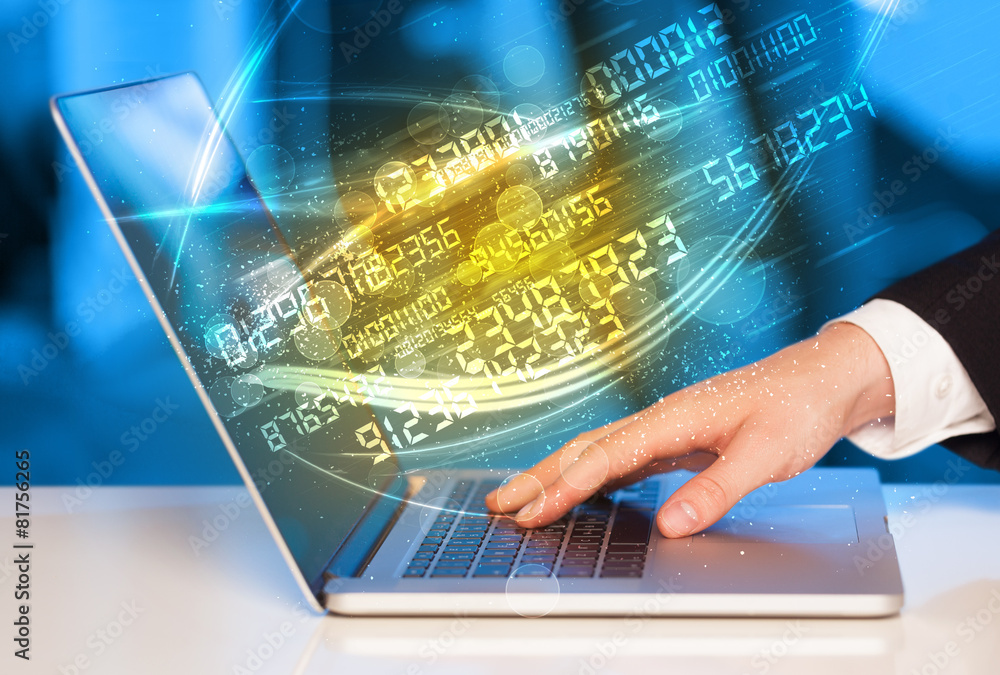 Man typing on modern notebook with number technology data coming Man typing on modern notebook with number technology data coming
