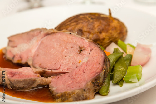 Slab of Prime Rib with Vegetables and Baked Potato