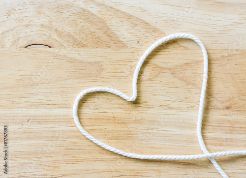 Heart Rope on a Wooden background
