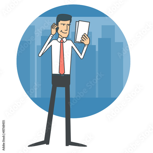 Businessman talking on the phone and reading documents