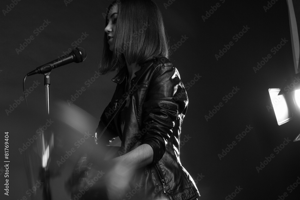 the girl playing guitar in the Studio the girl playing guitar in the Studio