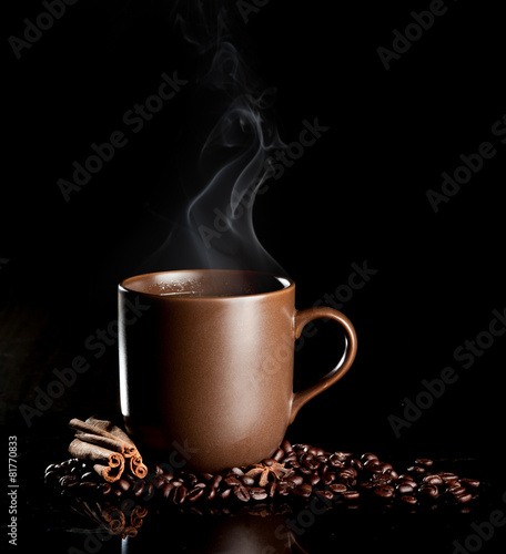 aromatic cup of coffee with smoke and beans
