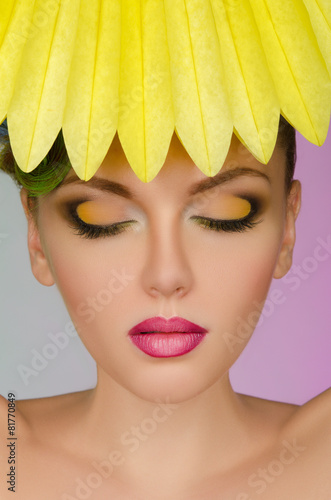 Beautiful woman with yellow paper