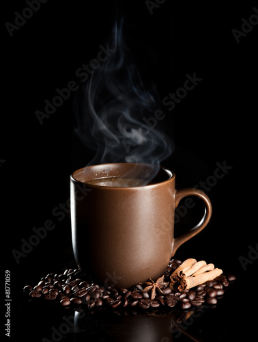 aromatic cup of coffee with smoke and beans