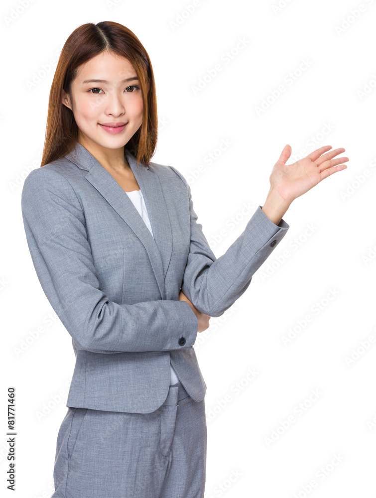 Smiling woman showing copy space for product Smiling woman showing copy space for product