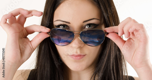 girl looks out of glasses