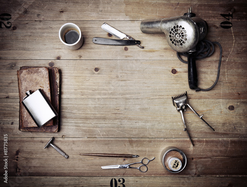 Vintage barber shop equipment on wood background with place for
