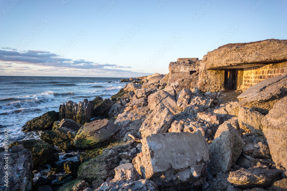 waves crushing over rocks in sunset