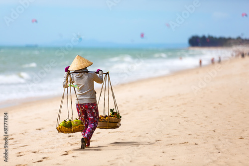 Vietnamese woman selling Fruits at Mui Ne beach. Vietnam