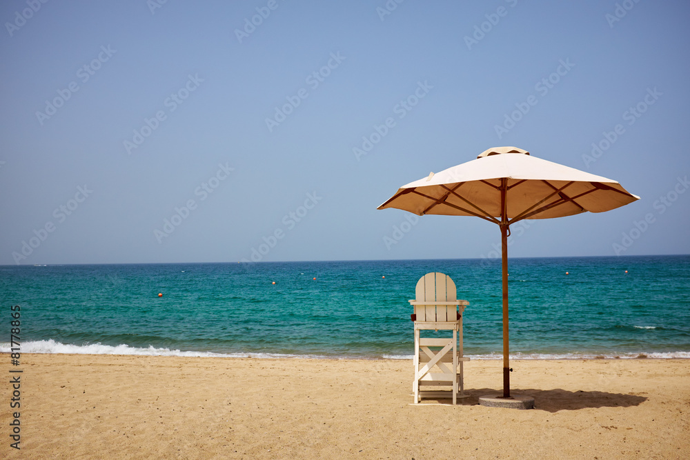 A lifeguard's chair on the beach.