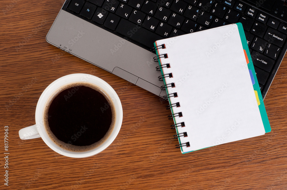 work office desk with a cup of coffee computer laptop and notebo work office desk with a cup of coffee computer laptop and notebo
