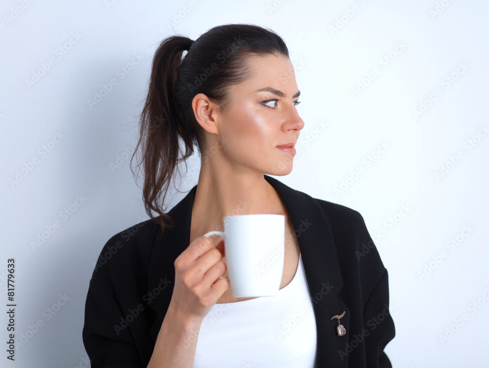 Young woman holding a mug, isolated on white background Young woman holding a mug, isolated on white background