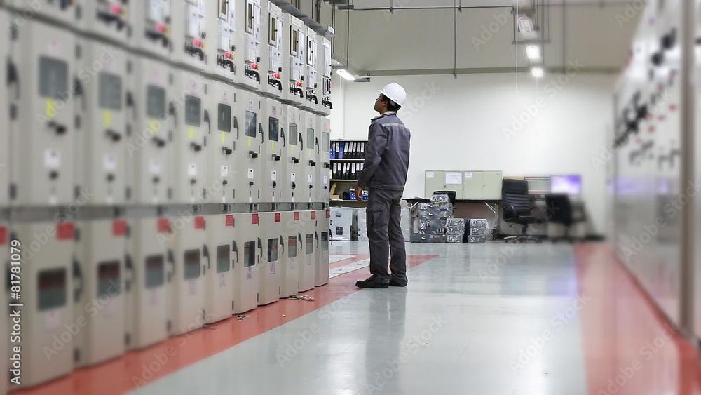 Engineer working in electrical substation Engineer working in electrical substation