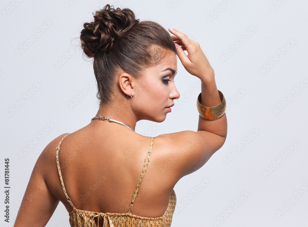 Young beautiful brunette woman with beads