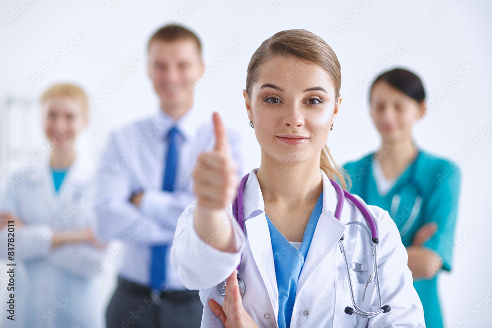 Young happy female doctor showing thumbs up Young happy female doctor showing thumbs up