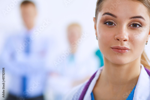 Woman doctor standing with stethoscope at hospital