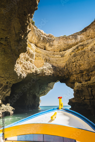 Boat in the cave on Algarve coast in Portugal.
