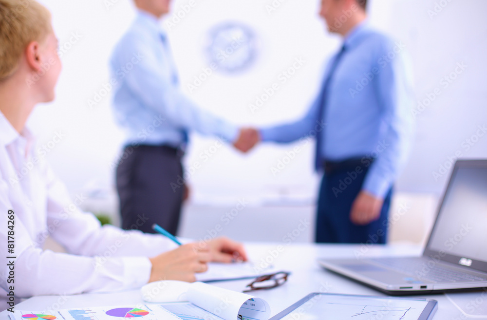 Business people shaking hands, finishing up a meeting Business people shaking hands, finishing up a meeting