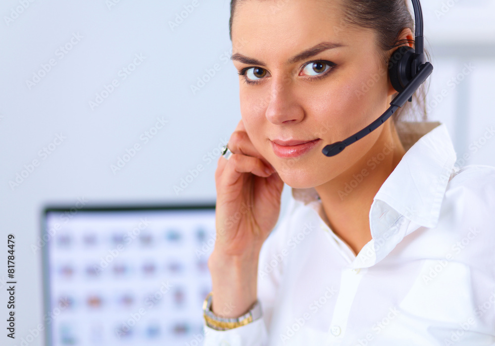 Close-up portrait of a customer service agent sitting at office Close-up portrait of a customer service agent sitting at office