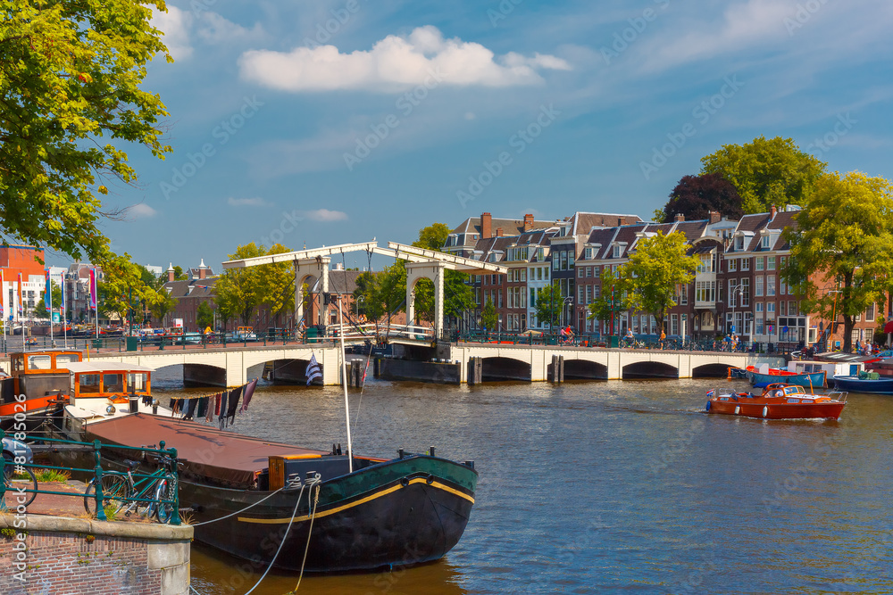 Fototapeta premium Amstel and bridge Magere Brug, Amsterdam, Holland