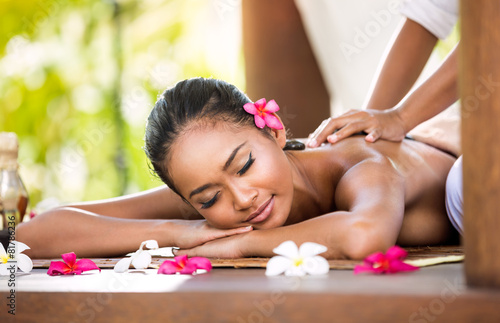 Woman having relaxing massage in spa salon
