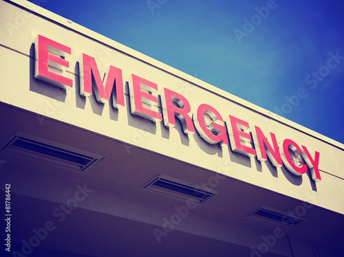 the front entrance sign to an emergency room department in a cit