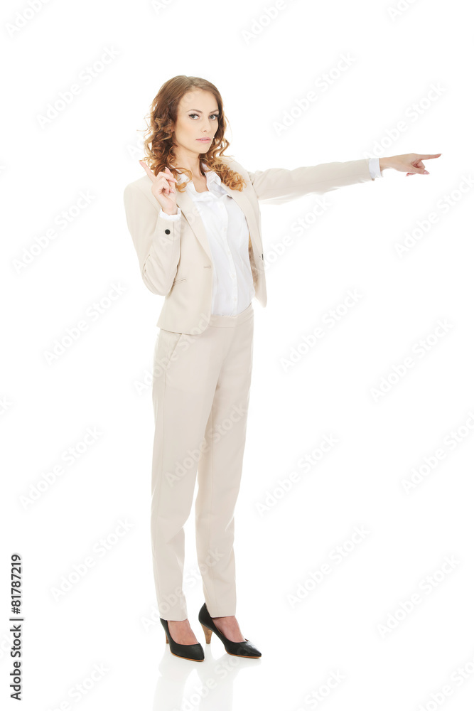 Attractive businesswoman pointing her finger. Attractive businesswoman pointing her finger.