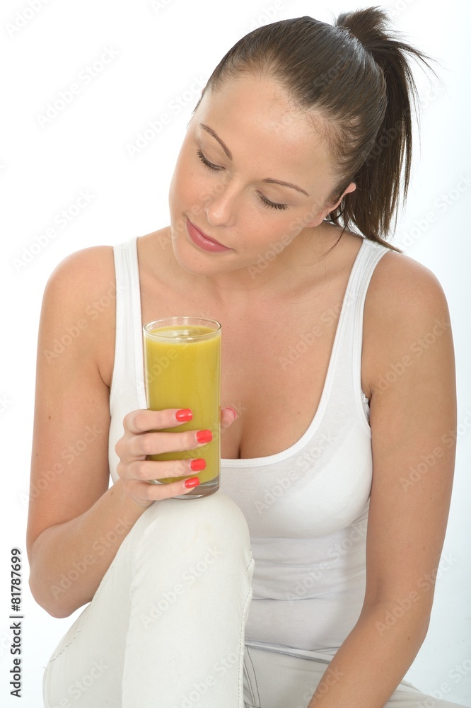 Healthy Young Woman Holding a Glass of Lime and Mango Smoothie Healthy Young Woman Holding a Glass of Lime and Mango Smoothie