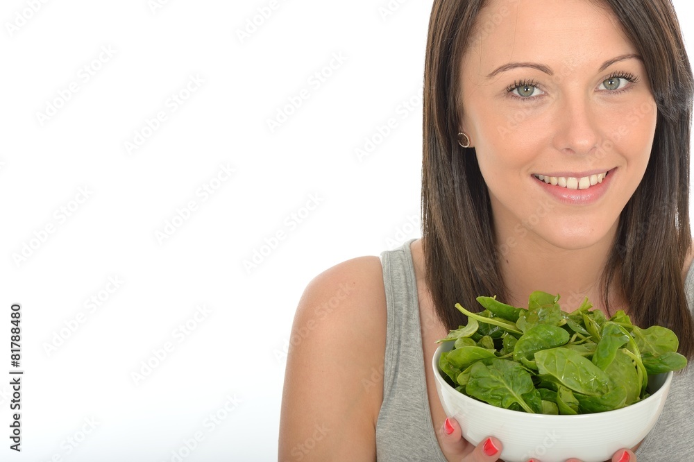 Attractive Healthy Young Woman Holding A Bowl of Spinach Attractive Healthy Young Woman Holding A Bowl of Spinach
