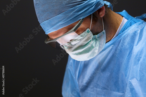 Man surgeon in an operating room photo