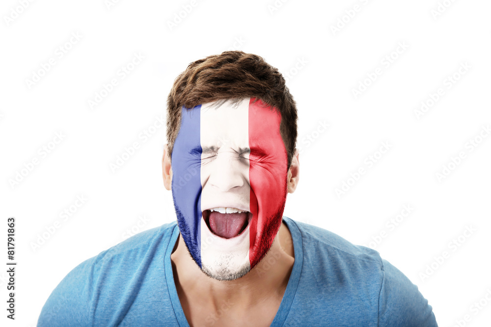 Screaming man with France flag on face. Screaming man with France flag on face.